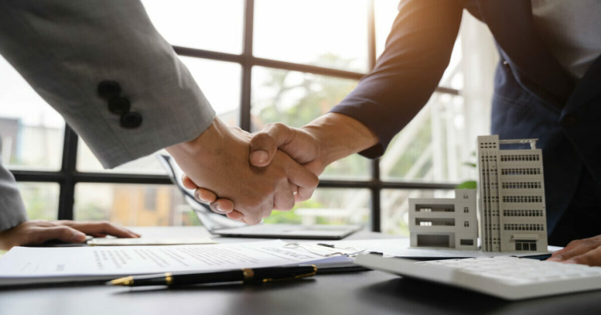 Shaking hands with the seller in close-up Seller Financing.