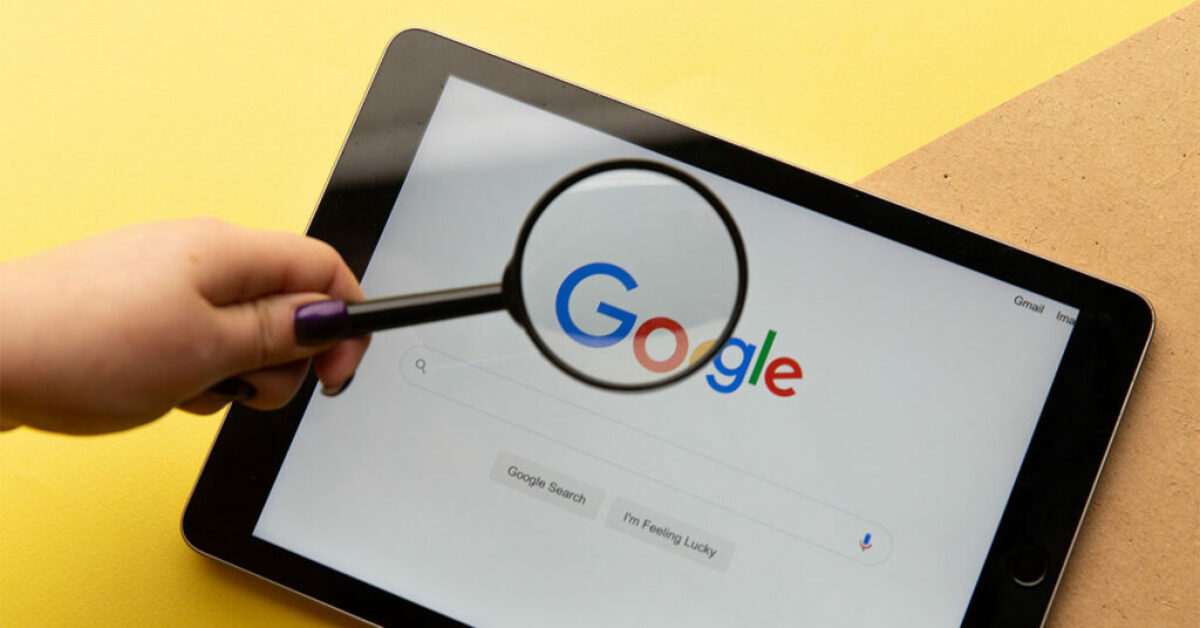 A magnifying glass zooming in google logo portraying the usage of google search and how google search can be used to find what you need