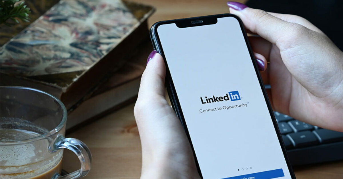 A human using mobile phone to check connections on linkedin