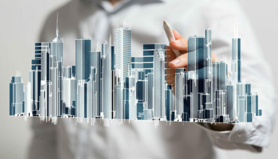 A man with an illustration of a cityscape with interconnected smart buildings and technology.