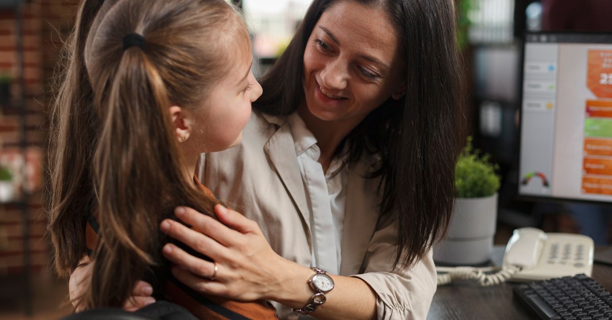 A smiling, happy mother demonstrates to her daughter the value of empathy.